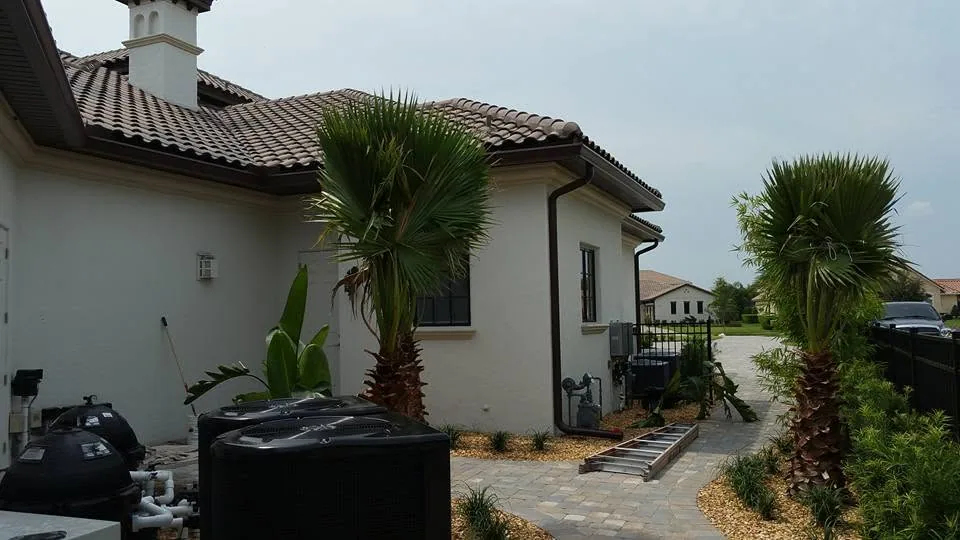 Bronze gutters white stucco home pool equipment pavers palms, Lake Mary